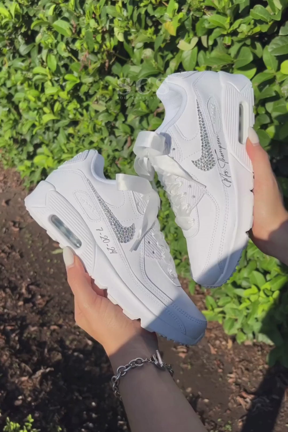 Personalised white wedding sneakers with the wedding date on the side